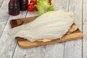 Raw halibut fillet photo