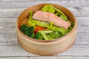 Steamed salmon with vegetables photo