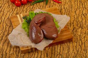 Raw pork kidneys photo