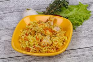 Traditional Pilaf with chicken and carrot photo