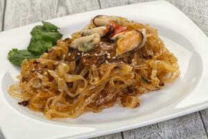 Wok noodle with mussels photo