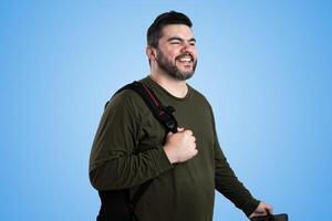 Bearded Man Smiling Under Clear Blue Sky photo