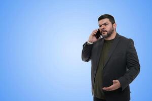 Businessman Using Smartphone in the City Under Clear Sky photo