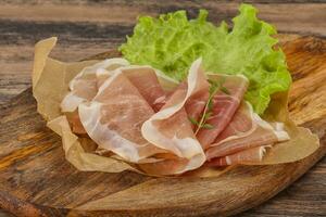 Italian prosciutto pork meat over board photo