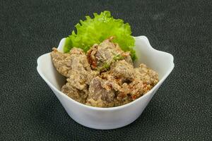 Chicken liver with cream and dry tomatoes photo