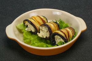 Stuffed eggplant roll with cheese and herbs photo