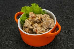 Chicken liver with cream and dry tomatoes photo