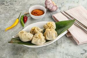 Chinese traditional steamed dumpligs momo photo