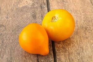 Ripe yellow bright juicy tomato photo