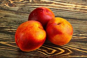 Ripe sweet juicy fresh red nectarines photo