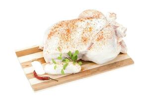 Raw chicken isolated on white background photo