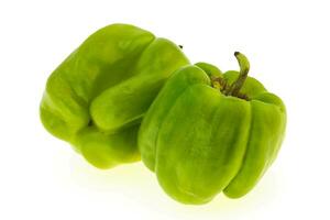 Two Green bell pepper isolated on white photo