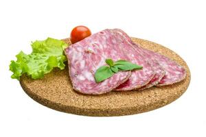 Salchichon salami isolated on white photo