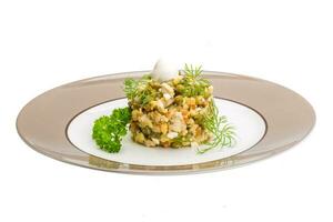 Russian salad isolated on white photo