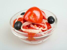 Marinaded tomatoes isolated on white photo