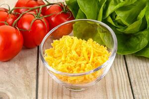 Shredded cheese in the bowl photo