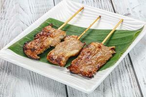 Thai cuisine - grilled pork skewer photo