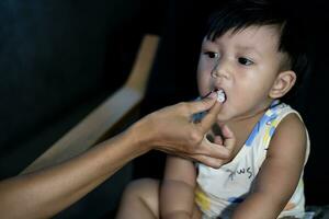 Mother Is Feeding Her Son photo