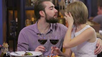 loving couple visits a restaurant and raised their glasses of wine video
