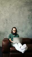 Productive Home Office. Young Woman Engaged in Laptop Work, Representing Work-from-Home, Freelancing, Business, and Lifestyle Concept for Students and Professionals. photo