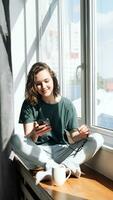 Digital Lifestyle. Woman Engaged in Productive Home Communication and Mobile Apps - Student Balancing Work, Study, and Connectivity in the Comfort of Her Room photo