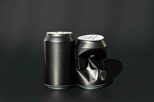 Two used aluminum beverage cans. Black soda can mock up. photo