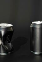 Two used aluminum beverage cans. Black soda can mock up. photo