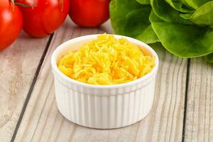 Shredded cheese in the bowl photo