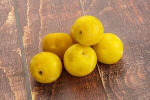 Yellow sweet plum heap fruit photo