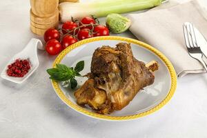 Baked Lamb shank with bone photo