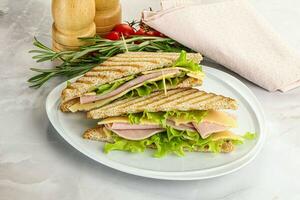 Homemade club sandwich with ham and cheese photo