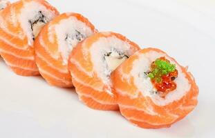 Japanese sushi traditional japanese food.Roll made of salmon, red cavair, roe and cream photo