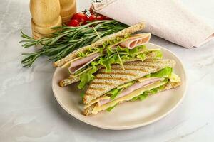 Homemade club sandwich with ham and cheese photo