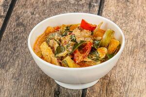 Thai red spicy curry with chicken photo