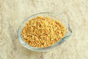 Crunched roasted peanut in the bowl photo