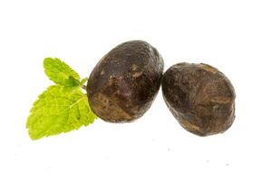 Nutmeg isolated on white photo