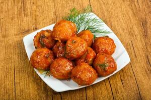 Meat balls over wooden photo