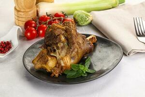 Baked Lamb shank with bone photo