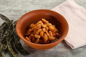 Canned white bean in tomato sauce photo