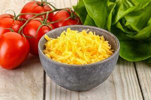 Shredded cheese in the bowl photo
