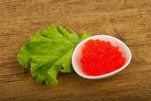 Red caviar in the bowl photo