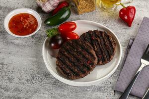 Grilled burger cutlet with sauce photo