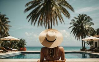 Back view of young woman in hat standing in swimming pool at resort. AI Generative photo