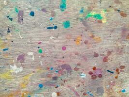 Abstract painting of a brush strokes on stained wood texture photo