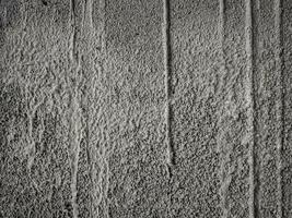 Grainy textured concrete wall for pattern and background photo