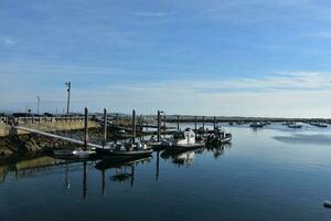 Boats Docked in Plymouth Harbor in the Summer photo