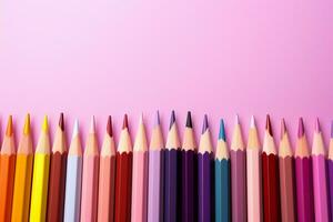 Colored pencils creatively arranged against a pink backdrop, offering copy space AI Generated photo