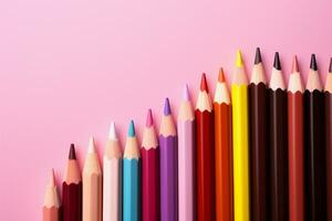 Artistic arrangement of colored pencils on a pink background with space AI Generated photo