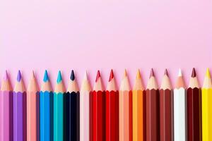 Vibrant colored pencils on pink background, providing ample space for text AI Generated photo