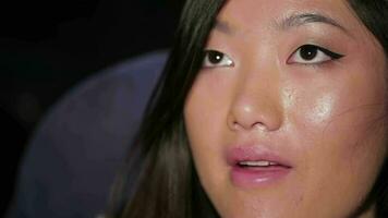 Portrait of asian girl while watching a movie video